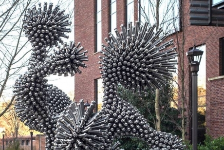 metal screws and bolts are arranged in the shape of a white blood cell