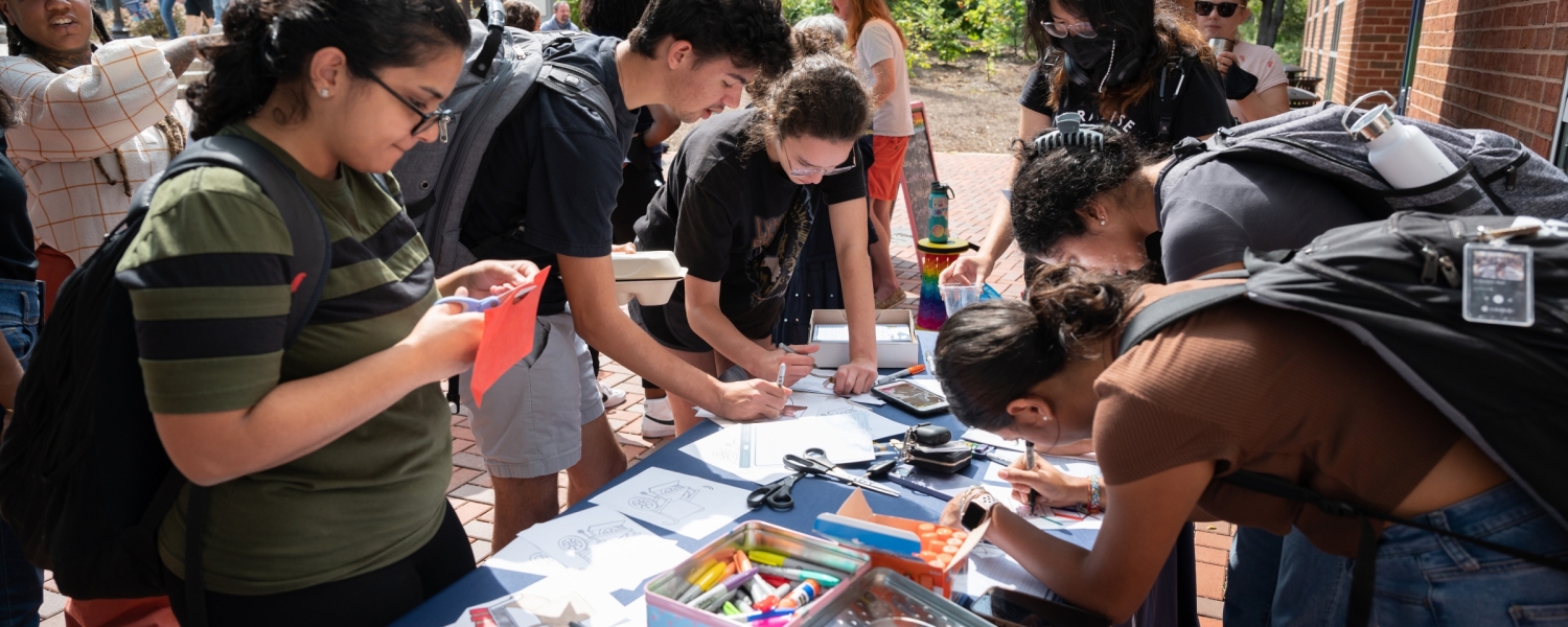 Students making paper chairs outside of the Ferst Center for The Arts.