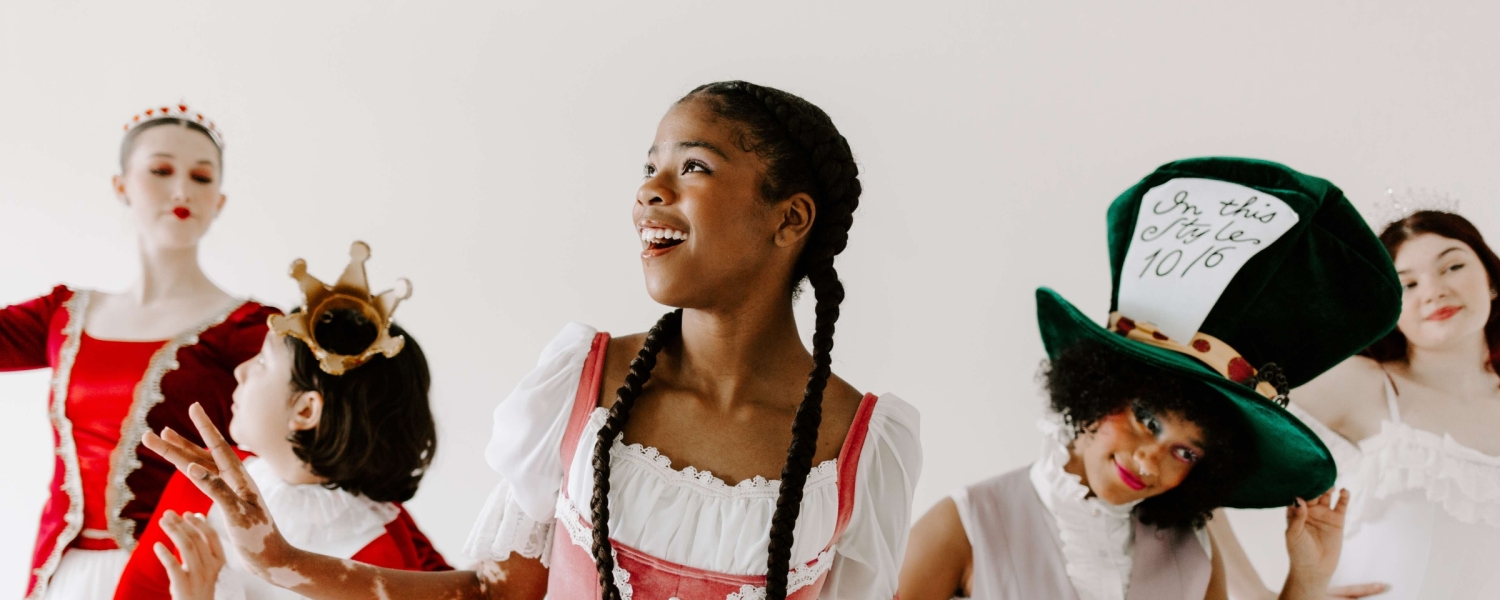 dancers dresses in alice in wonderland themed attire