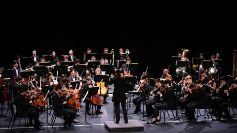 People playing musical instruments on stage