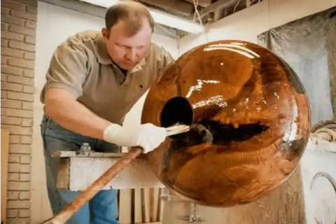 Matt Moulthrop shapes a bowl in a studio.