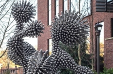metal screws and bolts are arranged in the shape of a white blood cell
