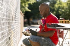 Artist Fabian Williams working on the mural.