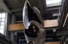 White aluminum amorphous shape with openings, suspended in the atrium of the Clough Undergraduate Learning Commons