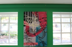 A painted panel each with images of dance, music, and art, the figures outlined in black and filled in with vibrant abstract colors and shapes