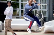 Two young men dancing, one in mid air. GT student organization TekStyles.