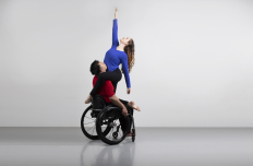  Full Radius Dance dancers, Juliana and Peter together in a photography studio photoshoot representing physically integrated dance.